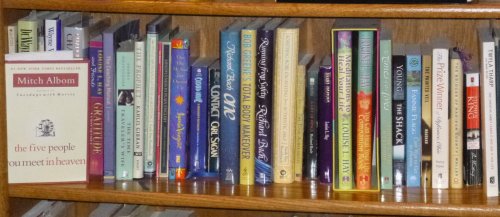 Photo showing various books on my bookshelf